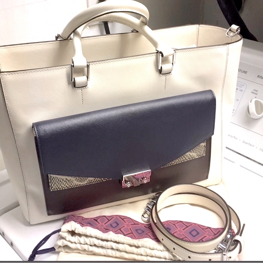 Gorgeous like new Tory Burch handbag in a rich winter white, navy, and brown.